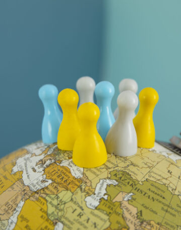 pawns-world-globe-with-blue-background